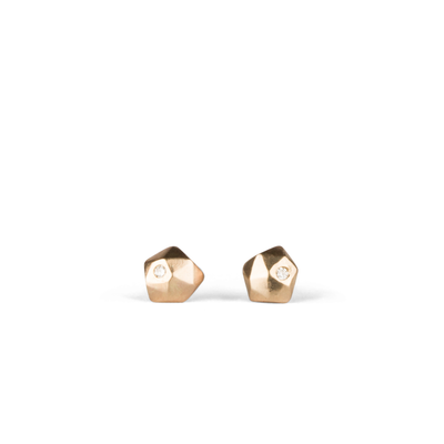14k yellow gold geometric faceted stud earrings with diamonds in the micro size on a white background by Corey Egan