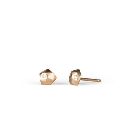 14k yellow gold geometric faceted stud earrings with diamonds in the micro size on a white background side view by Corey Egan