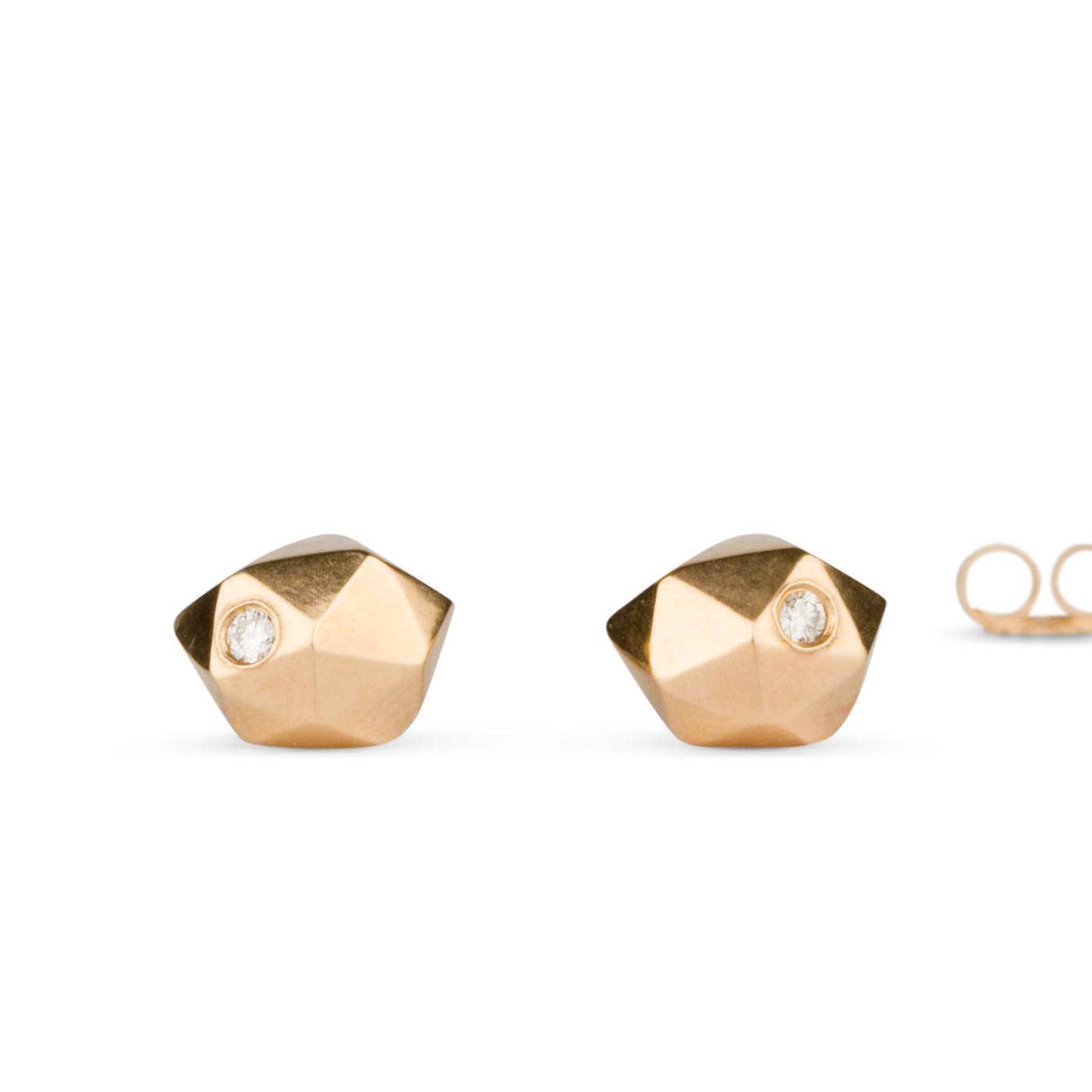Geometric faceted gold wabi-sabi stud earrings with white diamonds in 14k yellow gold on a white background by Corey Egan