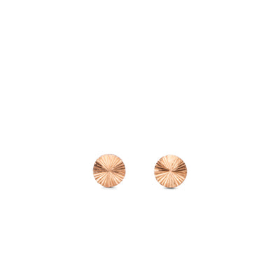 round rose gold stud earrings with sunburst engraving on a white backgound