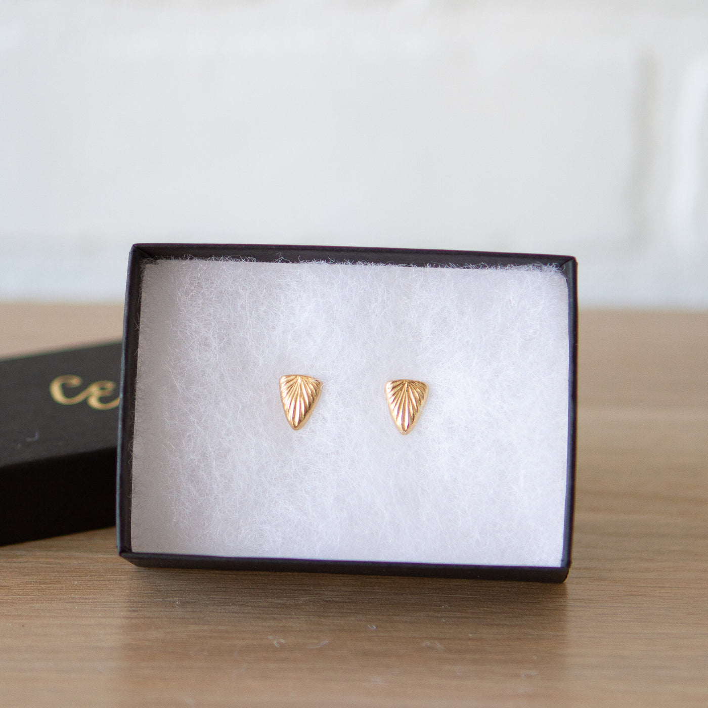 Triangle sunburst stud earrings in gold vermeil in a gift box
