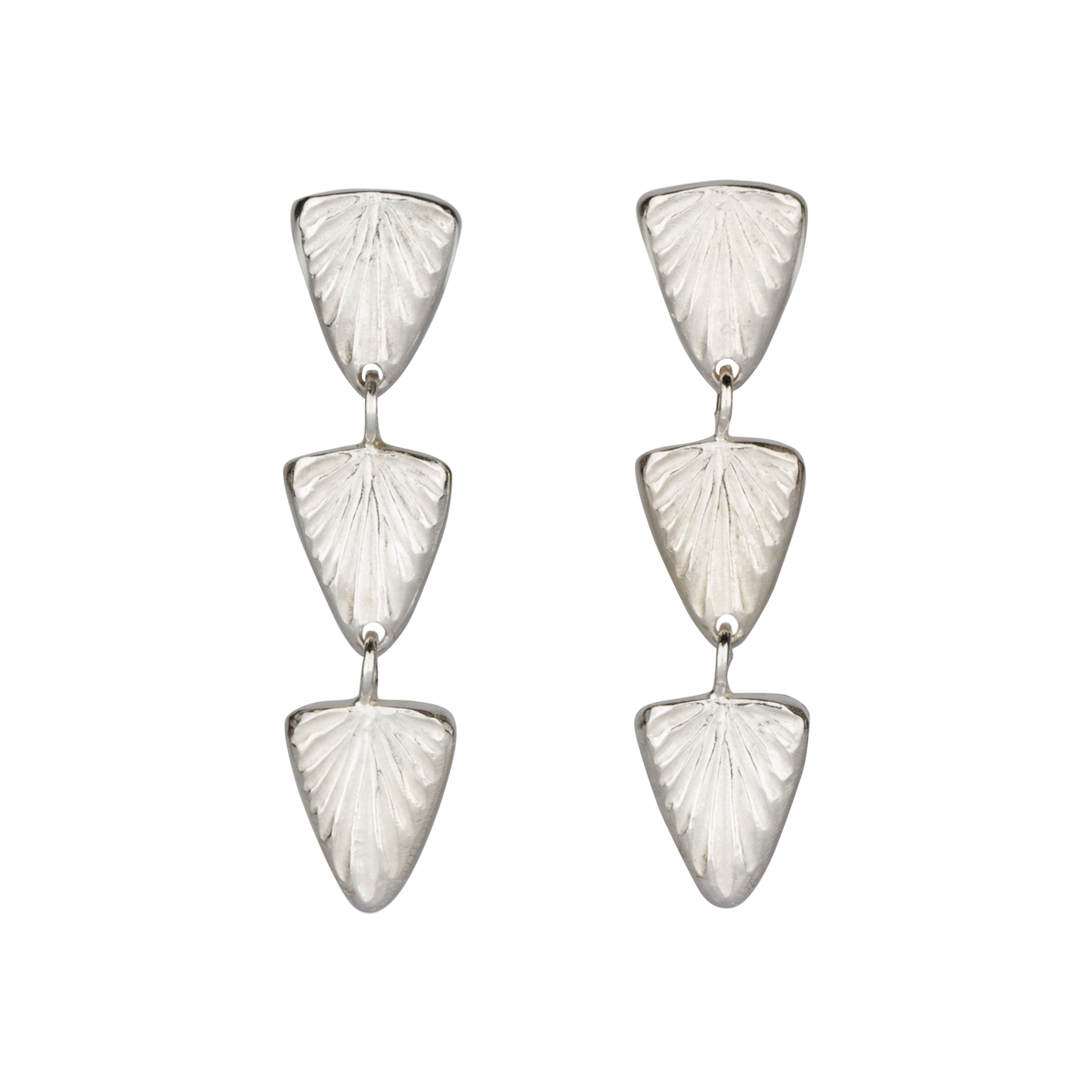 Sterling silver triple drop earrings of cared triangular sparks with post backs on white