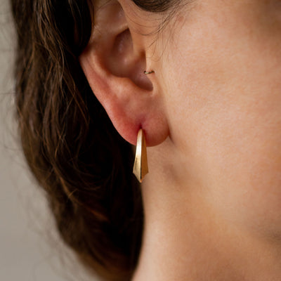 Sculptural Gold Textured Hoop Earrings on an ear