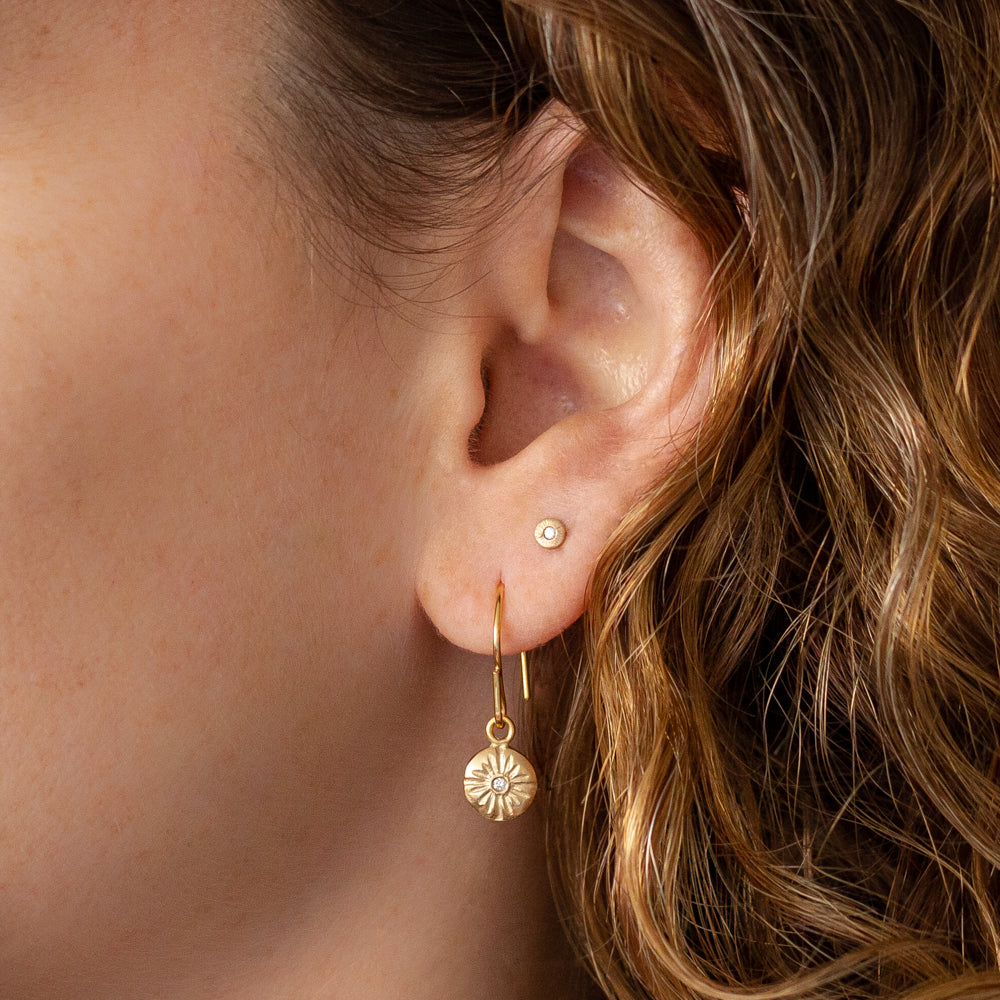Small Lucia Dangle Earrings in Vermeil on an ear by Corey Egan