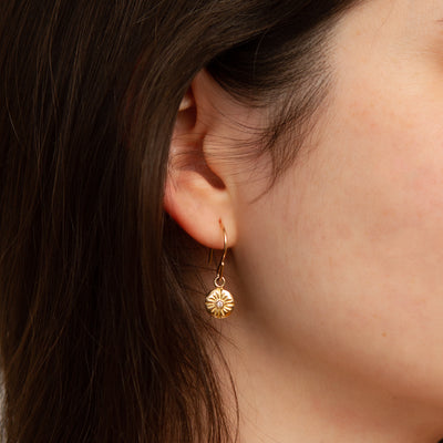 Small Lucia Dangle Vermeil Earrings modeled on an ear