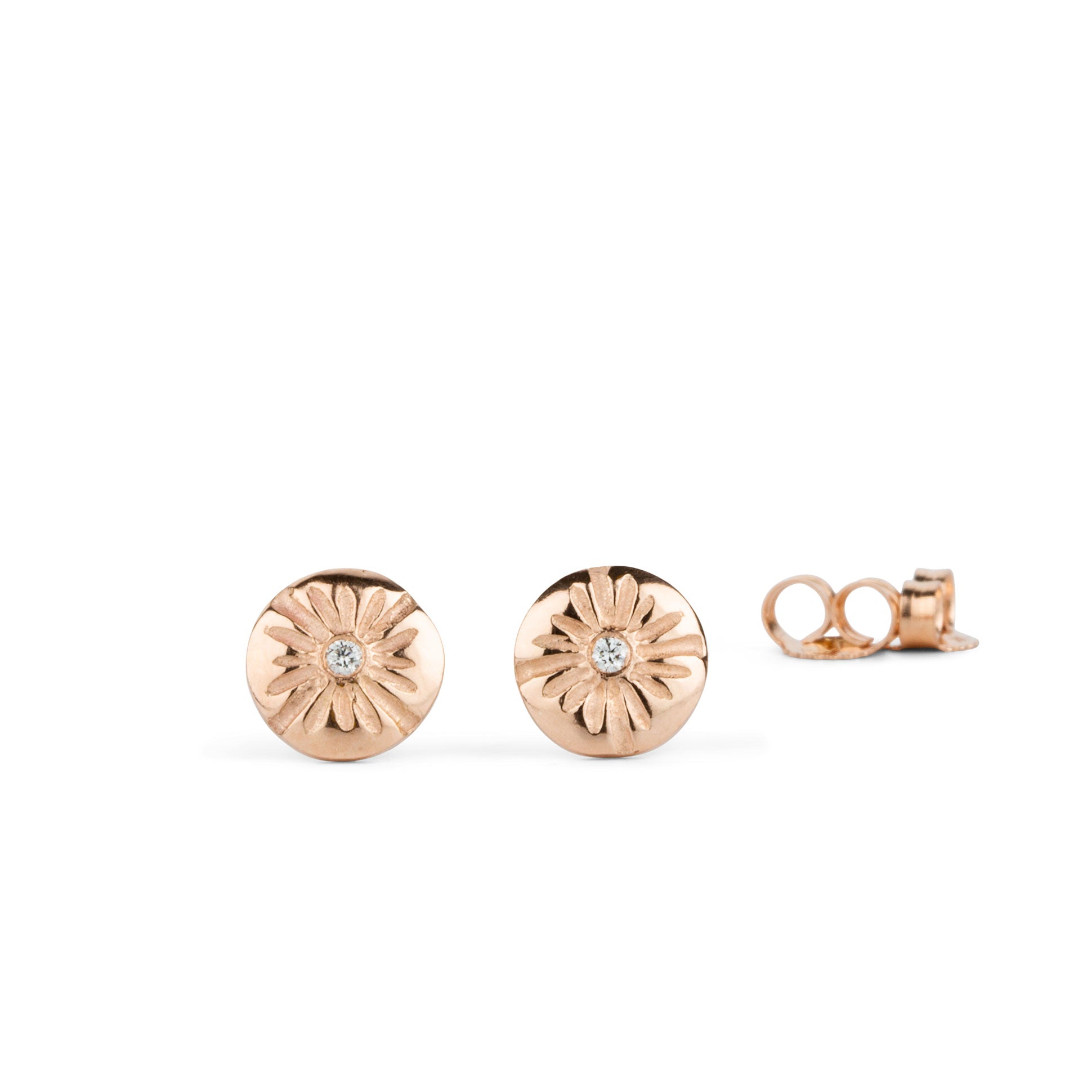 14k rose gold lucia stud earrings with white diamond centers on a white background