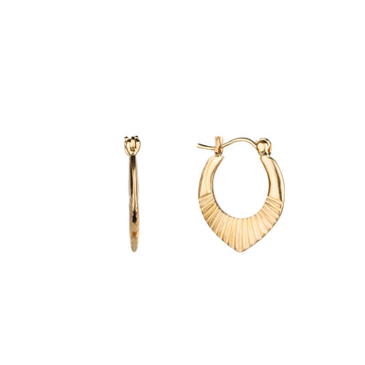 Side view of 14k yellow gold hinged hoop earrings with carved sunburst motif on a white background