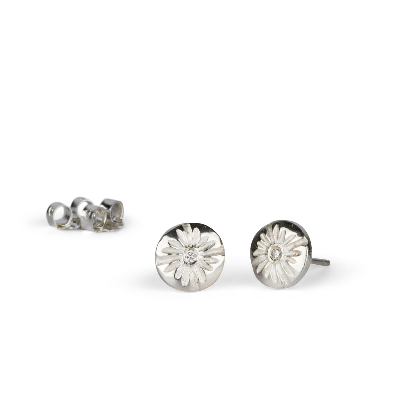 Small Lucia Diamond Stud Earrings on a white background side view by Corey Egan
