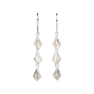 Flame Cascade Silver Dangle Earrings on a white background by Corey Egan