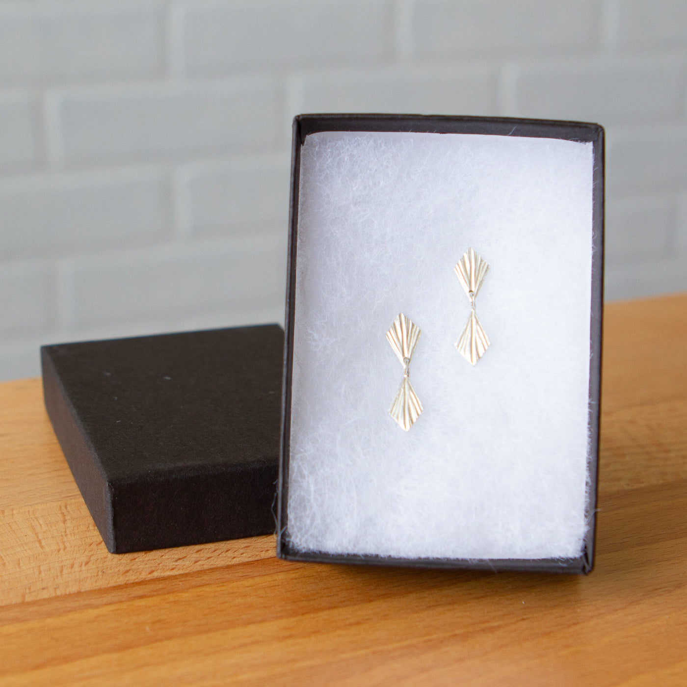 Double Flame Silver Dangle Earrings in a gift box