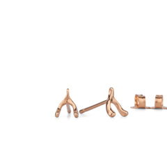 rose gold wishbone stud earrings on a white background