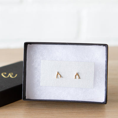 14k Yellow Gold Wishbone Stud Earrings by Corey Egan in a gift box