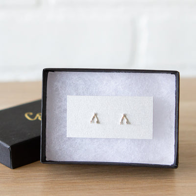 Silver Wishbone Stud Earrings by Corey Egan in a gift box