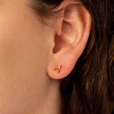 Vermeil Wishbone Stud Earrings by Corey Egan on an ear