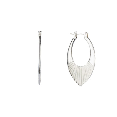 Medium Silver Oblong hoops with hinge closure and sunburst bottom by Corey Egan side view on a white background