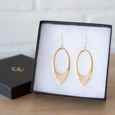 Gold vermeil large open petal shape earrings with textured bottoms in a gift box