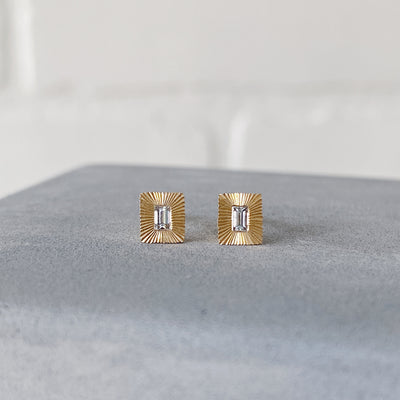 Rectangle 14k yellow gold Aurora stud earrings with baguette diamond centers and engraved rays