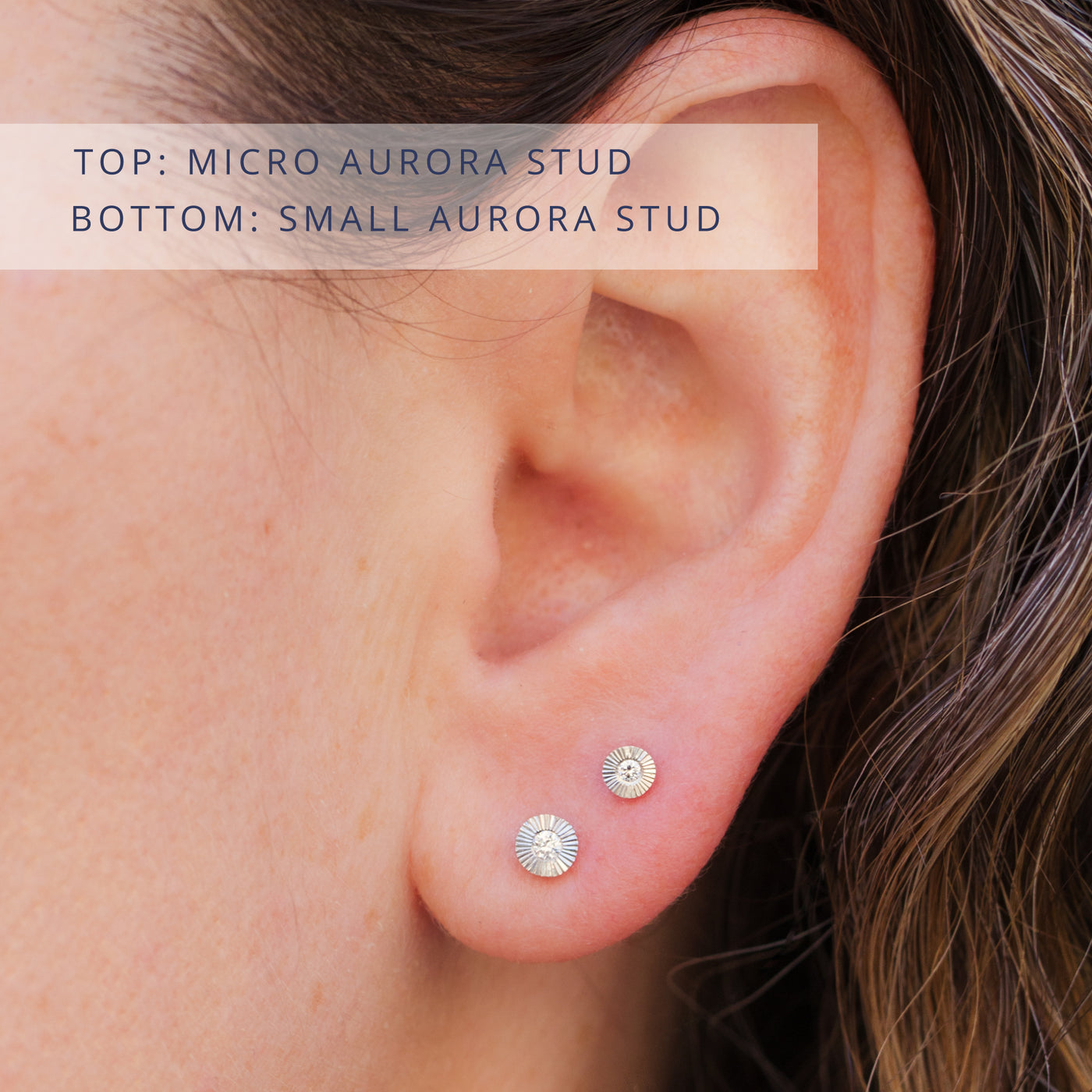 Silver and diamond aurora stud earrings on an ear. Top: micro size, Bottom: small size