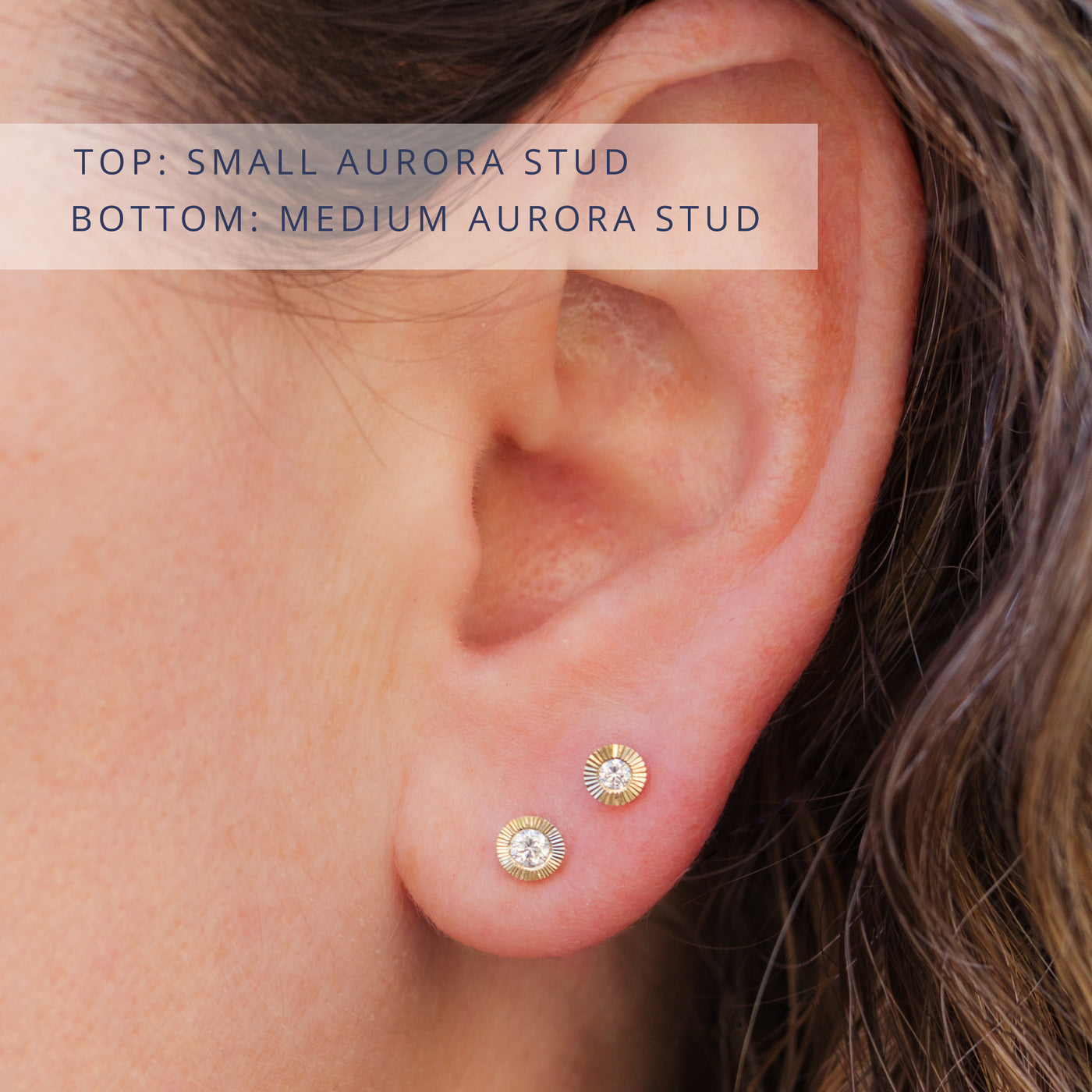 Aurora stud earrings on a model's ear. Top: 14k yellow gold small Aurora diamond studs, bottom: 14k yellow gold Medium Aurora diamond studs