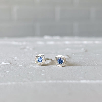 Sterling silver small engraved Aurora stud earrings with blue Yogo Montana Sapphires in natural light alternate view