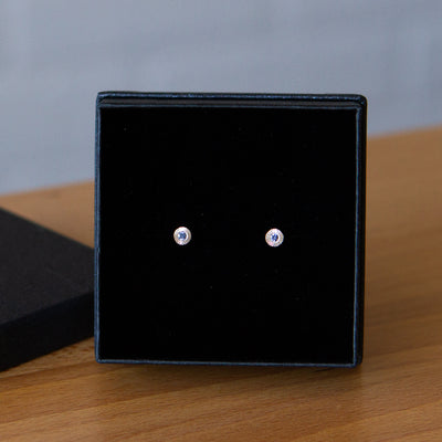 Sterling silver small engraved Aurora stud earrings with blue Yogo Montana Sapphires in a gift box