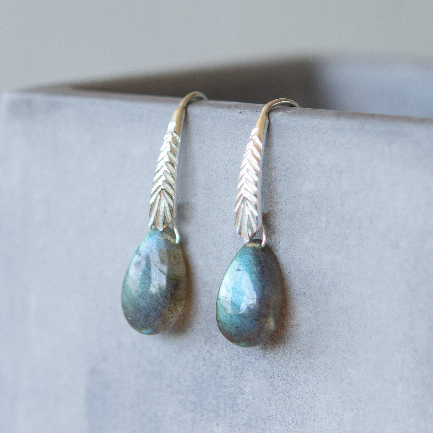 sterling silver Herringbone dangle earrings with pear shape smooth labradorite drops side view