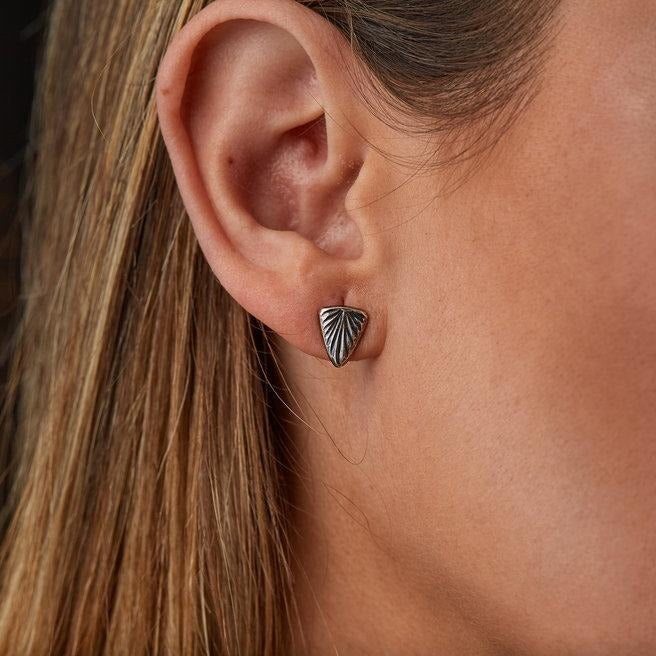Oxidized Silver Triangular Spark Studs on an ear