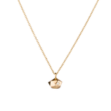 Faceted geometric gold tiny fragment necklace with a single white diamond in one facet on a white backrgound | Corey Egan