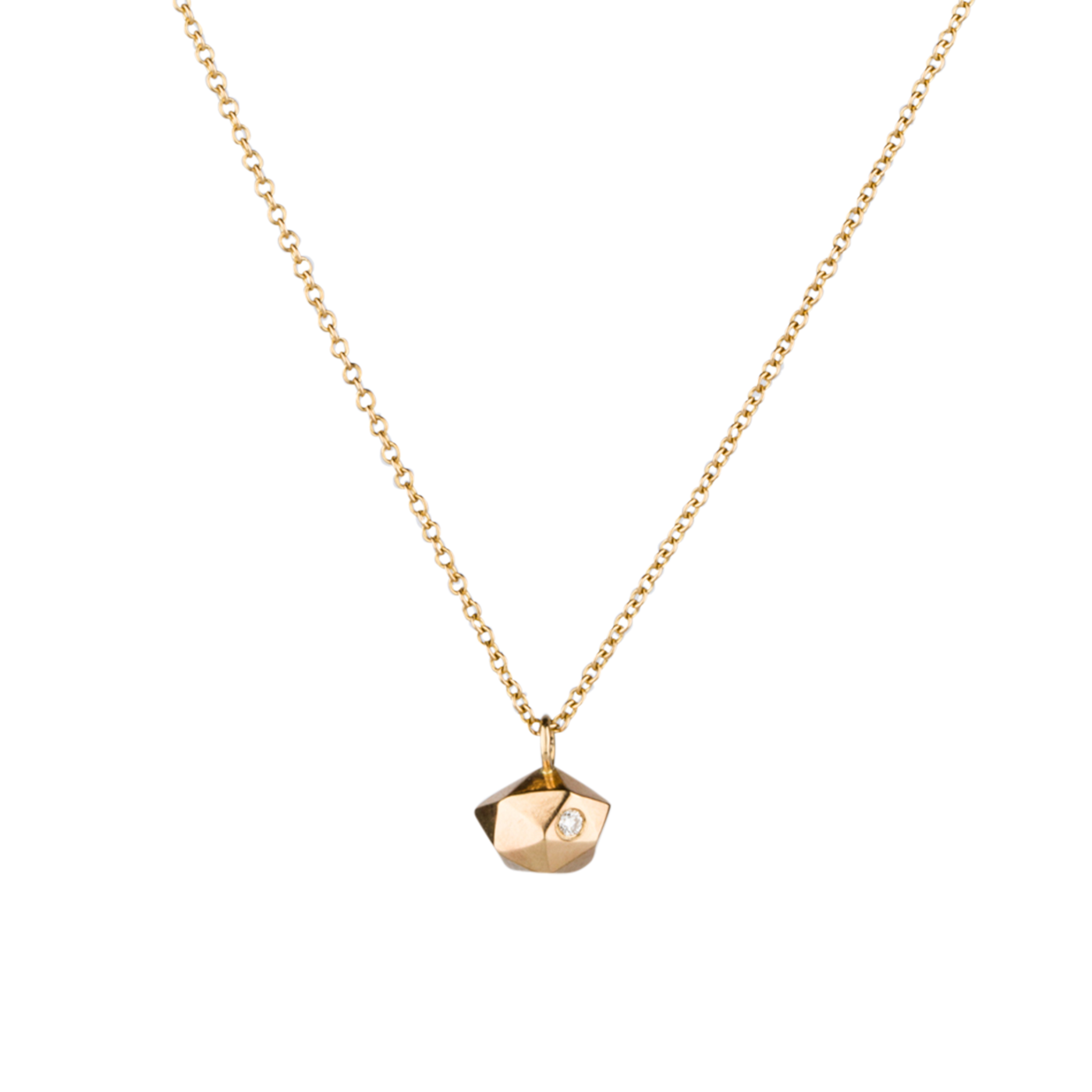 Faceted geometric gold tiny fragment necklace with a single white diamond in one facet on a white backrgound | Corey Egan