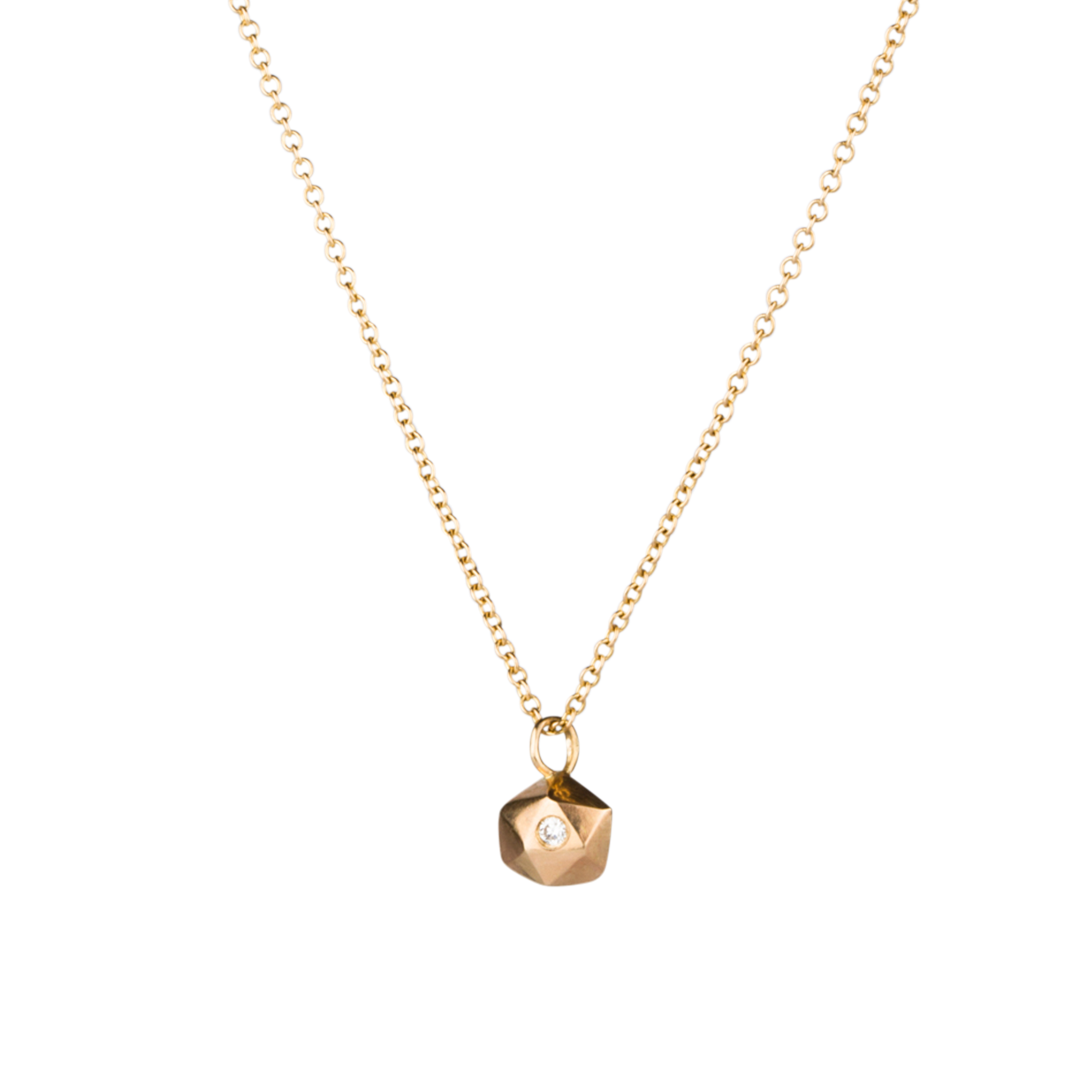 Faceted geometric gold tiny fragment necklace with a single white diamond in one facet side view on a white background | Corey Egan