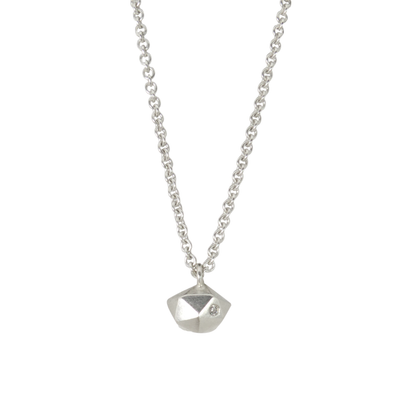 Sterling silver wabi-sabi faceted geometric necklace with a single diamond facet by Corey Egan on a white background