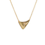 Triangular gold flash necklace with a diamond center and sunburst carved motif in 14k yellow gold. by Corey Egan