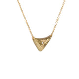 Triangular gold flash necklace with a diamond center and sunburst carved motif in 14k yellow gold. by Corey Egan