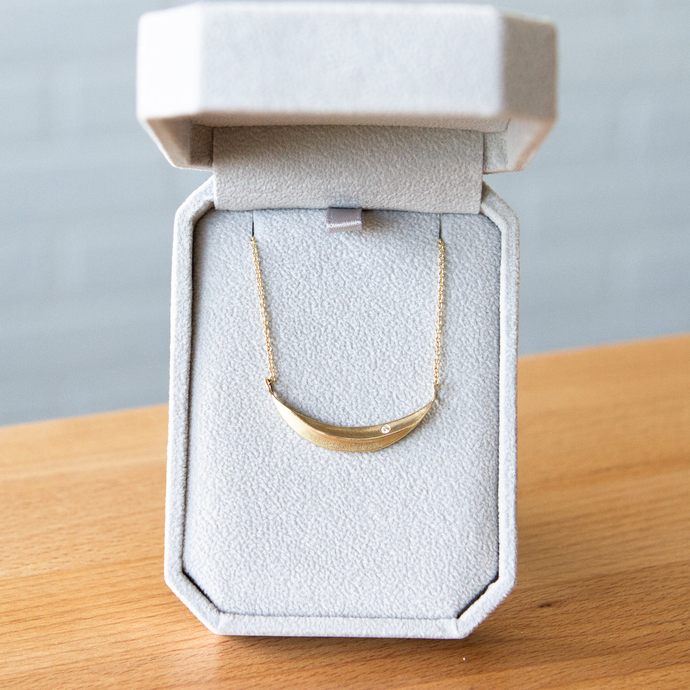 Gold and Diamond Wisp Necklace by Corey Egan  in a gift box