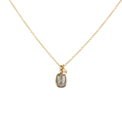 Cushion Shape grey opaque diamond in a yellow gold bezel pendant paired with yellow gold engraved diamond pendant on gold chain