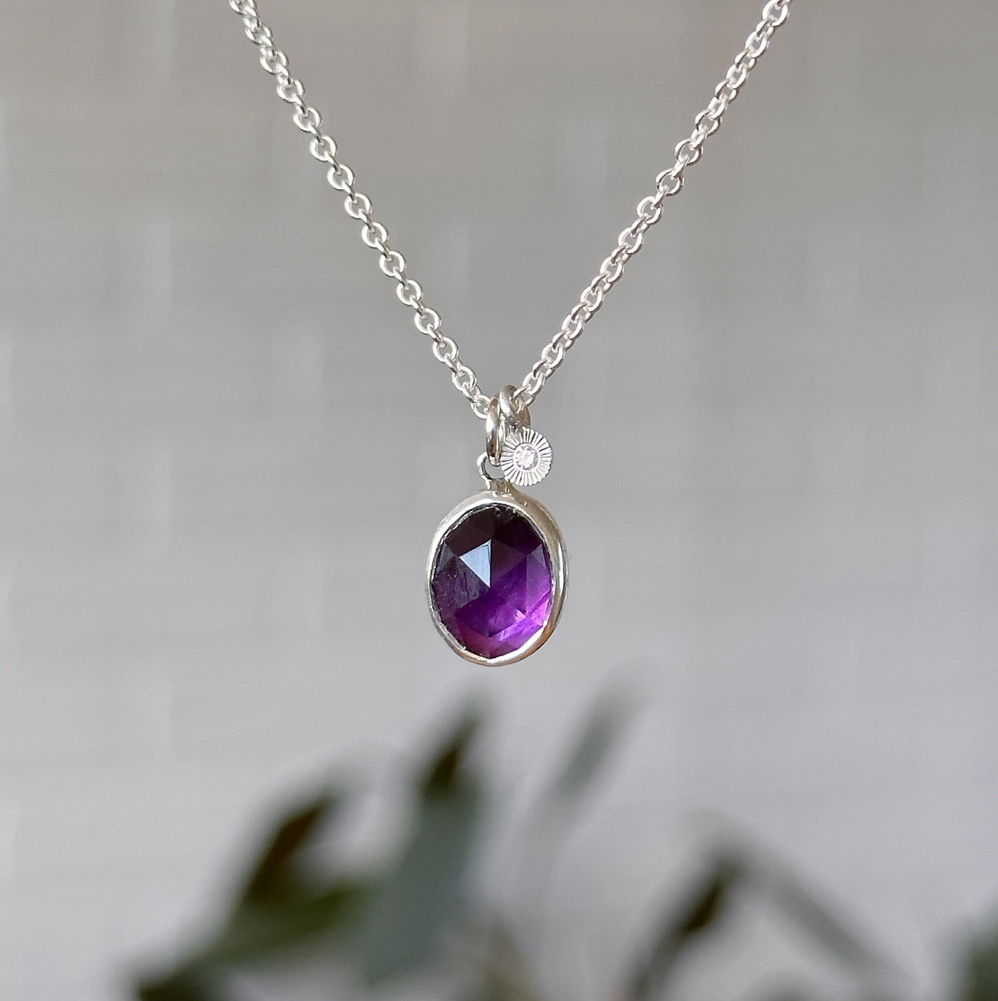 Amethyst Silver Theia Necklace in front of a white wall, front angle