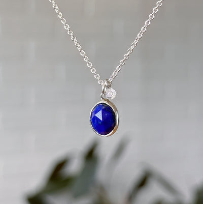 Lapis Silver Theia Necklace in front of a white wall, front angle