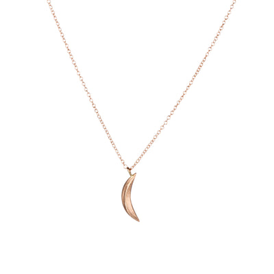 Rose Gold Small Wisp Moon Necklace by Corey Egan on a white background