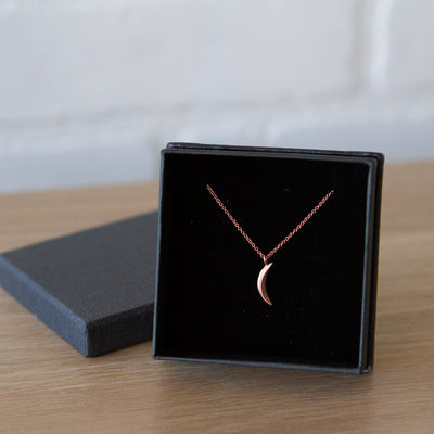 Rose Gold Small Wisp Moon Necklace by Corey Egan in a gift box