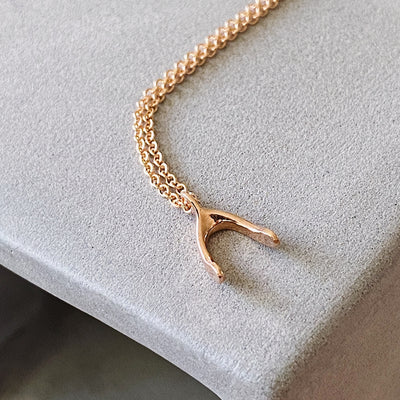 Rose Gold Wishbone Necklace by Corey Egan
