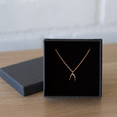 Gold wishbone necklace in a gift box