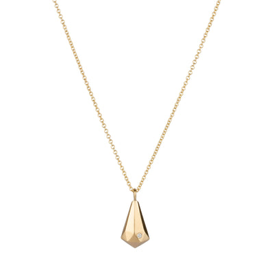 14k yellow gold faceted crystal fragment pendant with a diamond and a gold chain on a white background