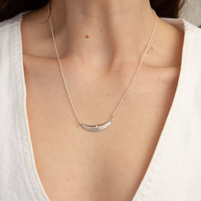 Silver and Diamond Icarus Necklace modeled on a neck