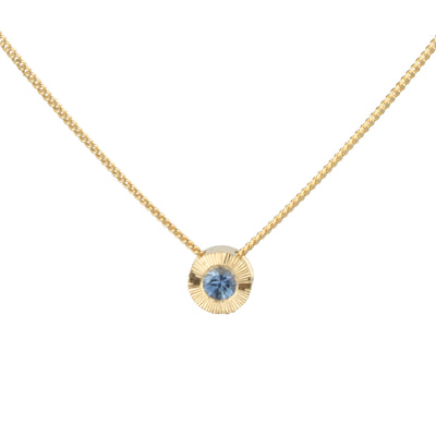 14k yellow gold small aurora necklace with a blue montana sapphire center 