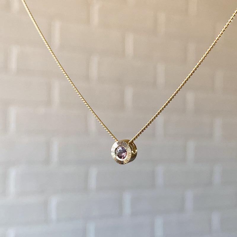 14k yellow gold small Aurora necklace with pink Montana sapphire center