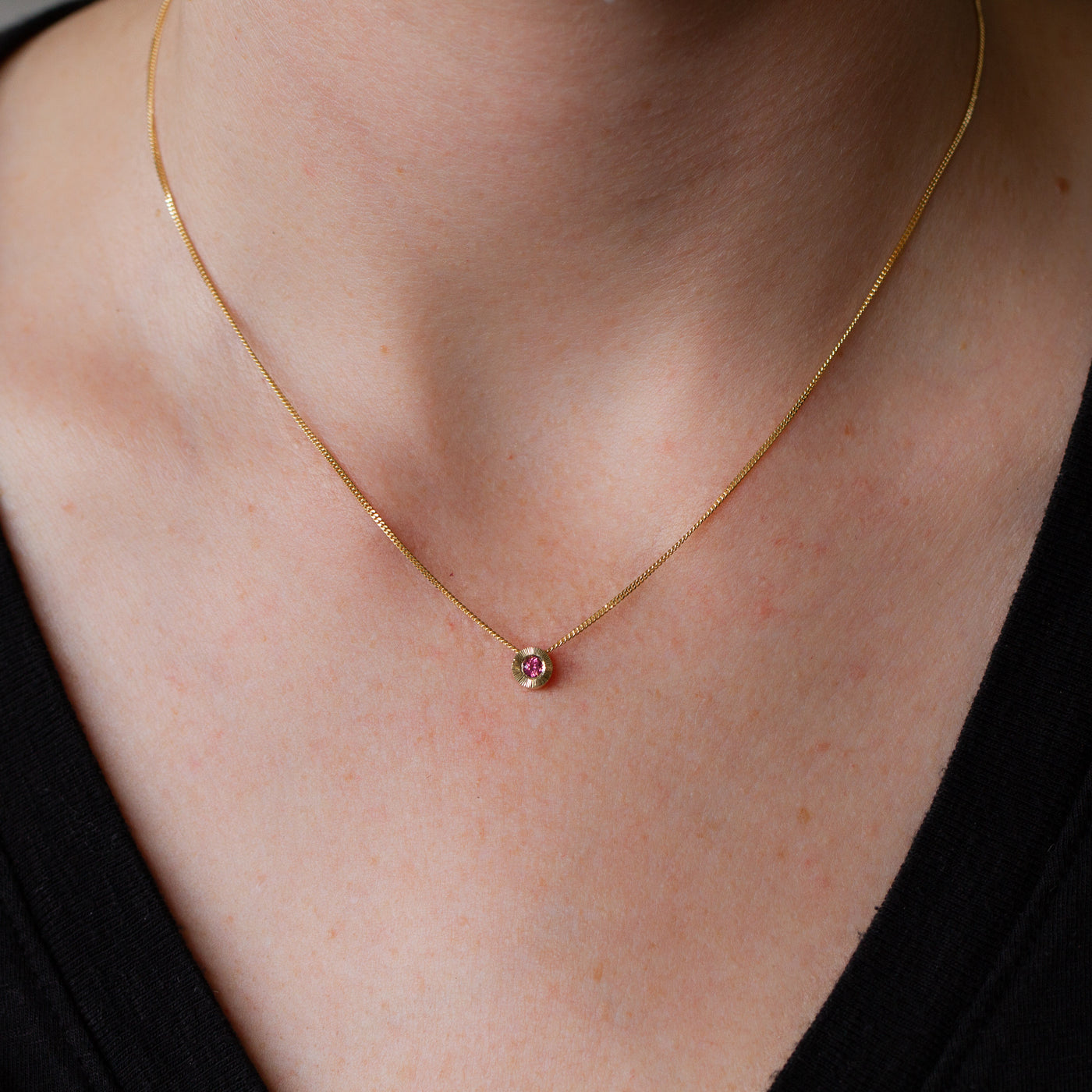 October birthstone Aurora slide necklace with pink tourmaline in yellow gold on a neck
