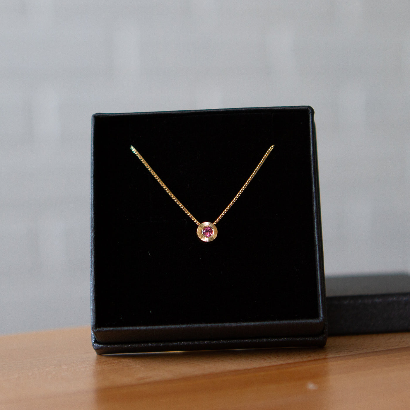 October birthstone Aurora slide necklace with pink tourmaline in yellow gold in a gift box