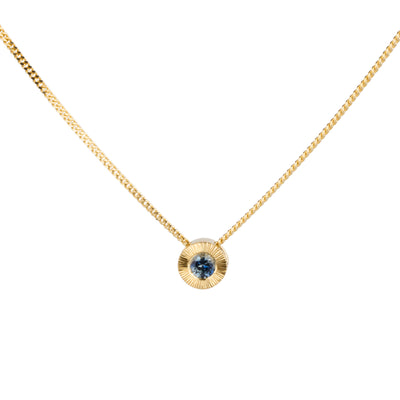 14k yellow gold small aurora necklace with a denim blue Montana sapphire center on a white background 
