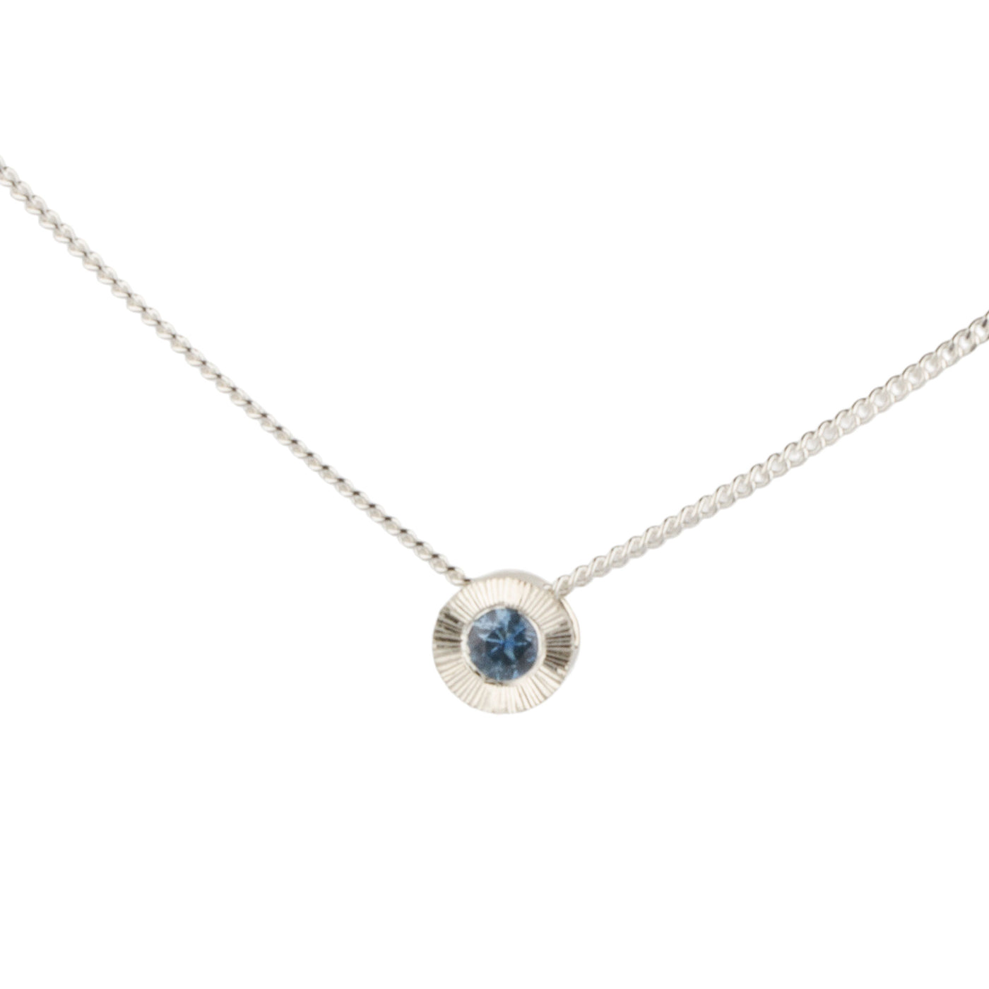 Sterling silver small aurora necklace with a blue Montana sapphire center on a white background