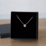 Sterling silver small aurora necklace with a blue Montana sapphire center in a gift box